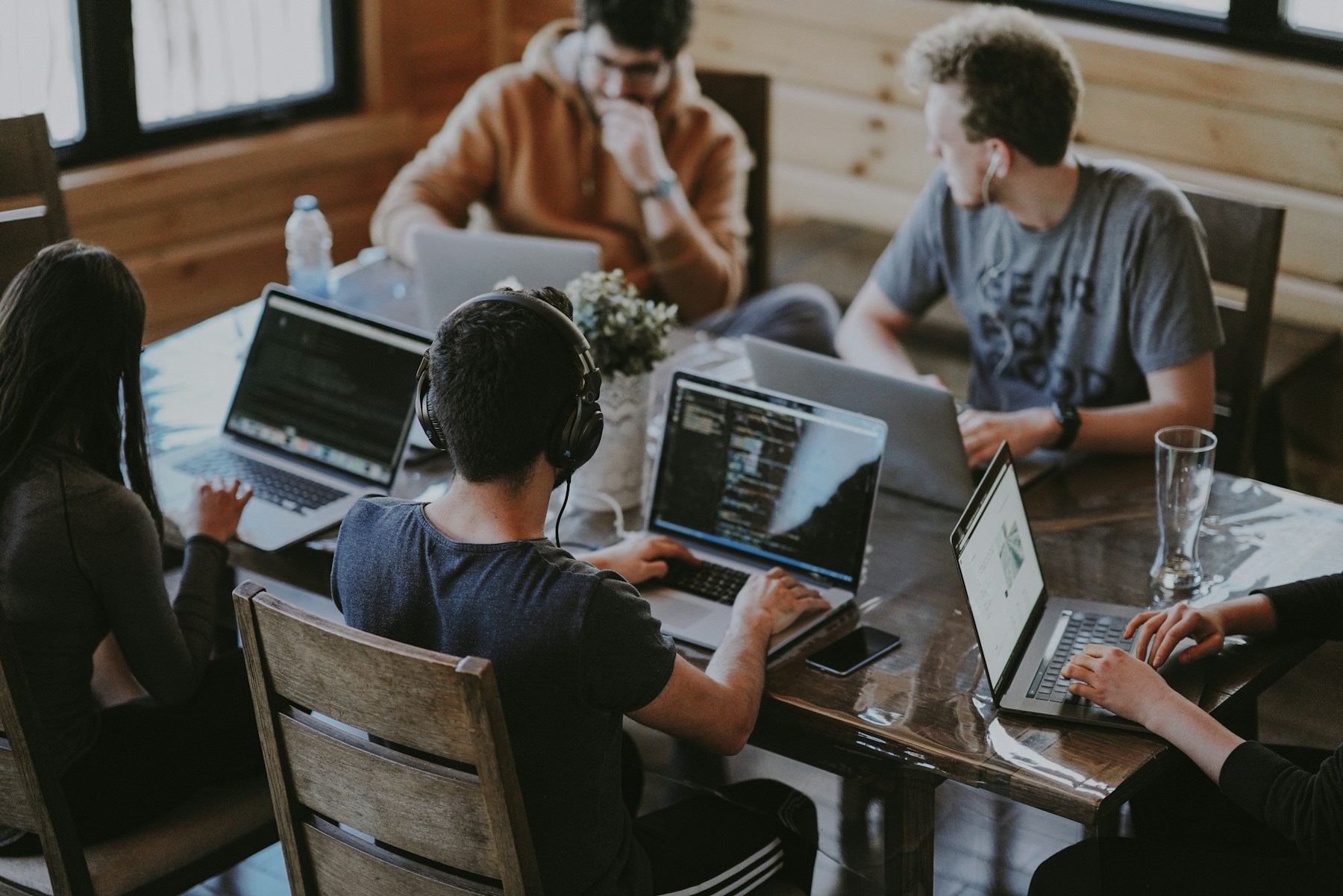 A group of people working together on a laptop